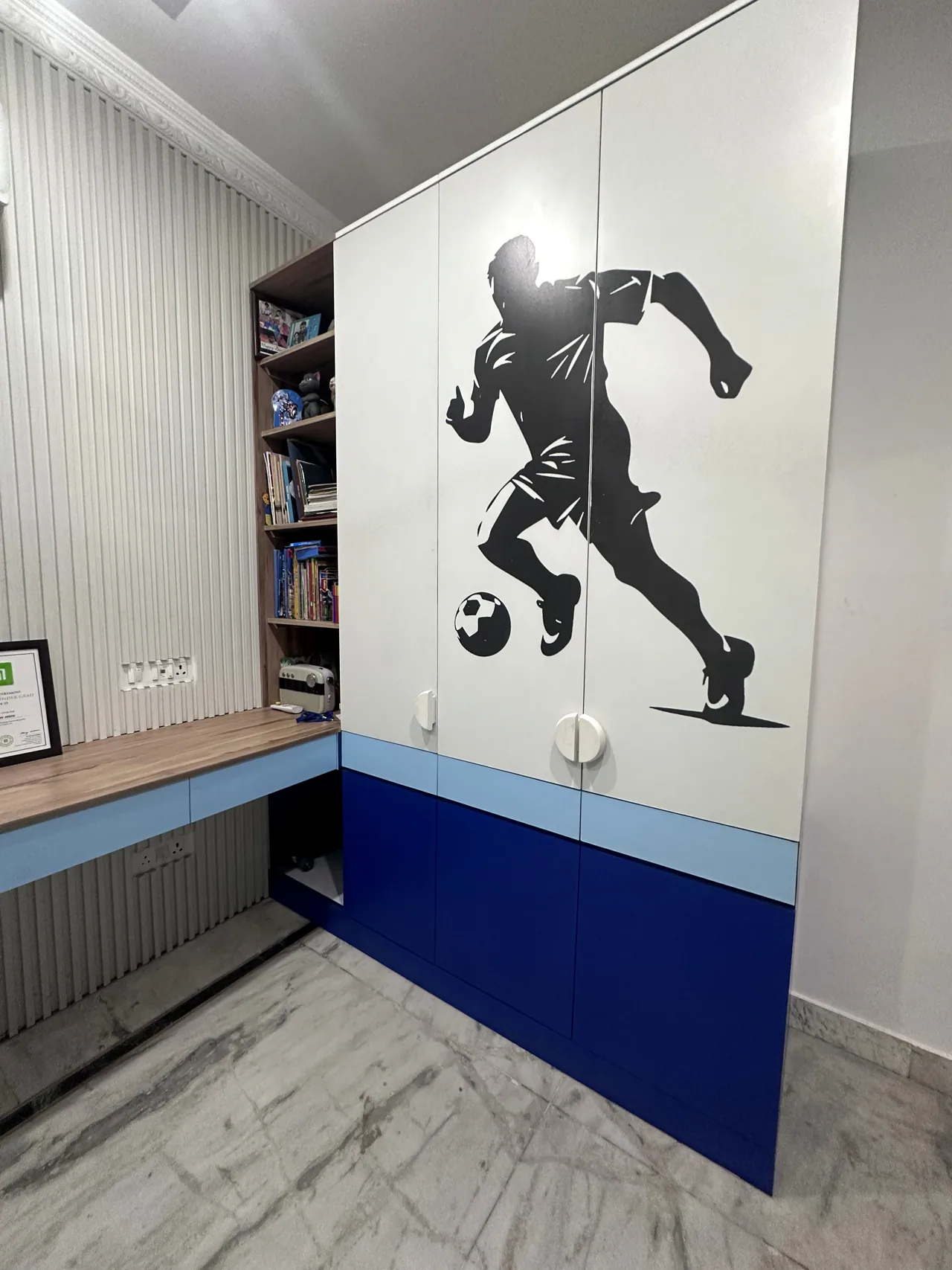 Footballer wall graphic beside the built-in study counter