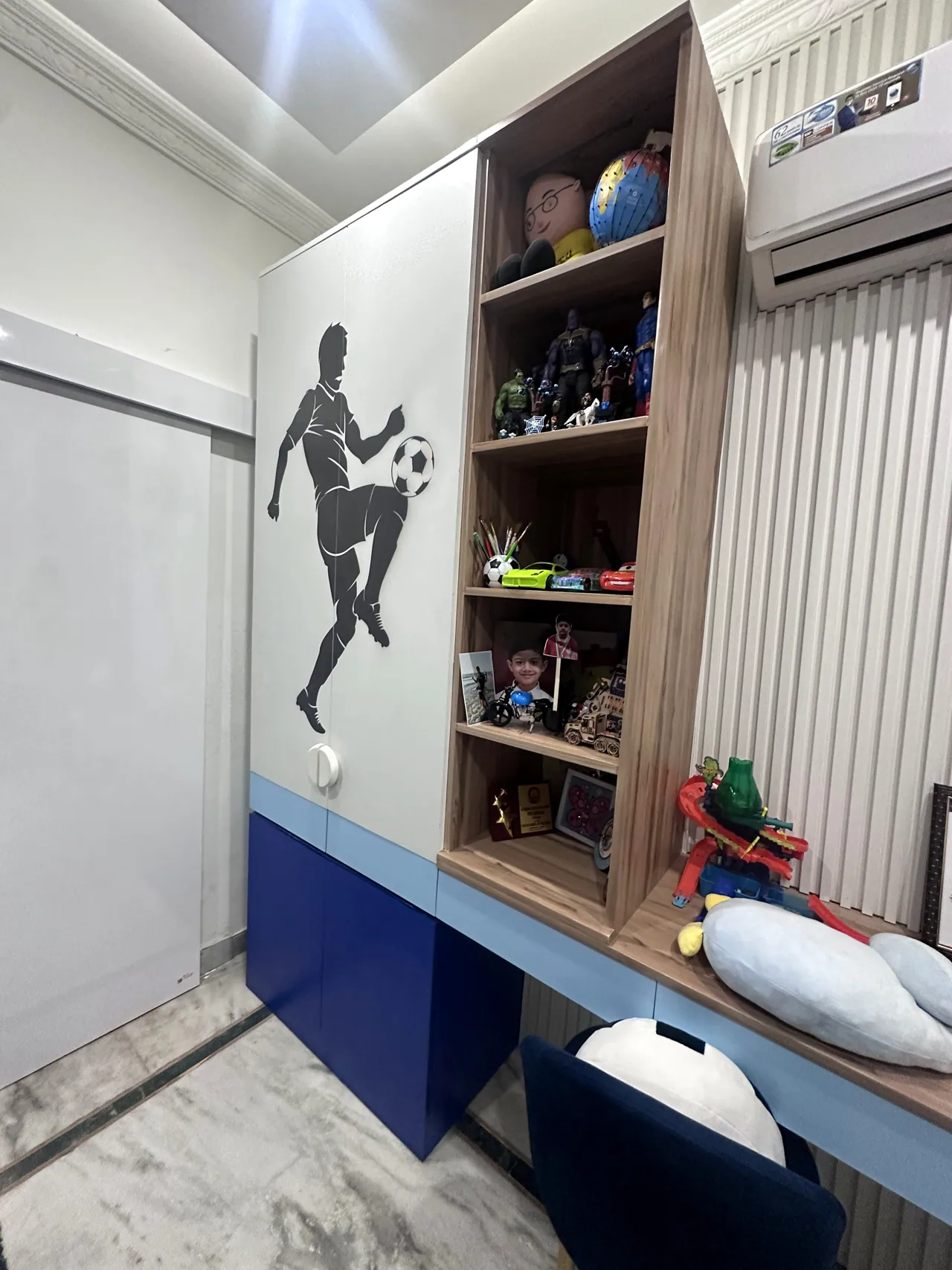 Desk, footballer graphic and wardrobe in the children’s bedroom
