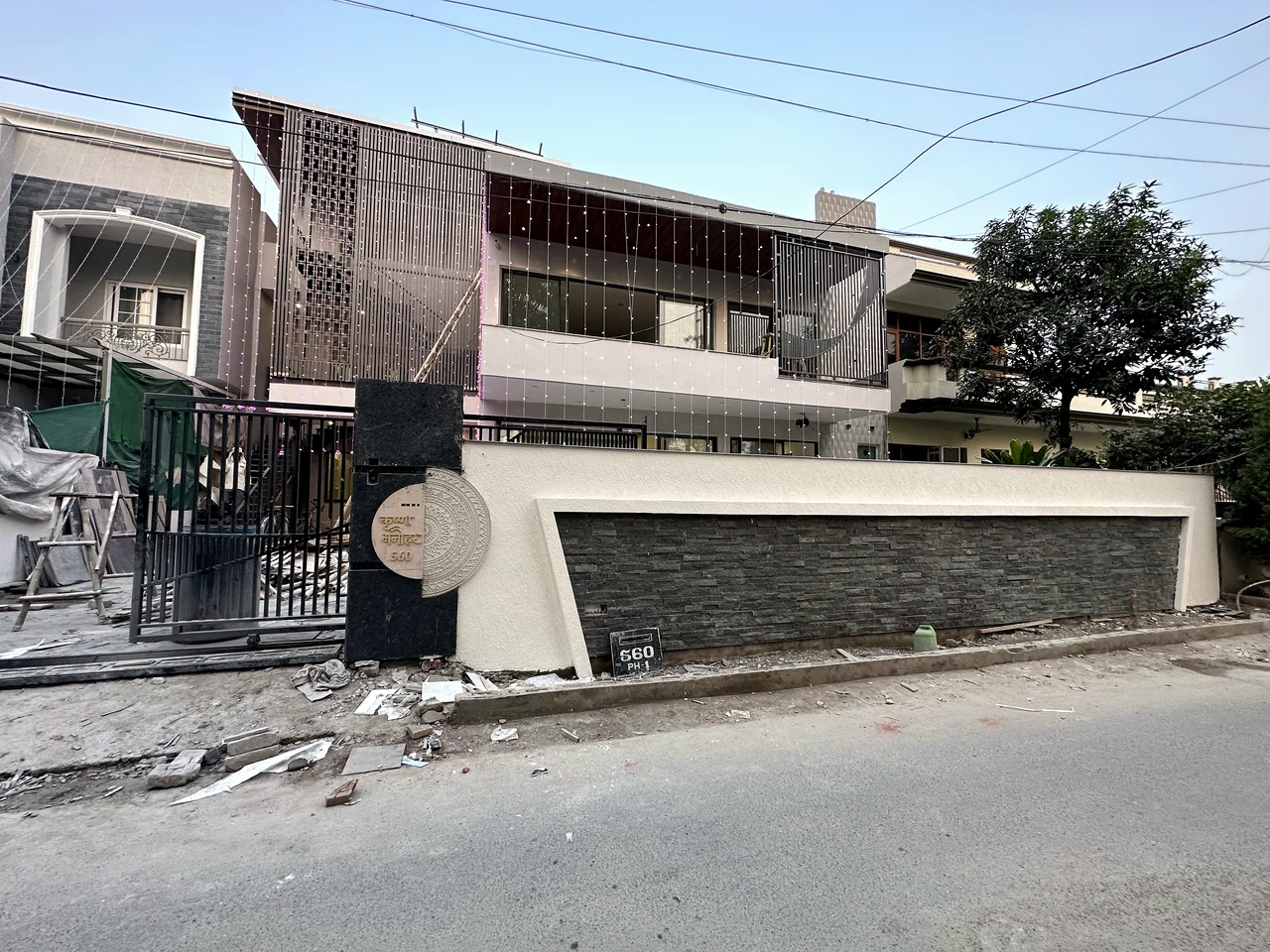 Exterior view showing the upper facade, boundary wall and gate