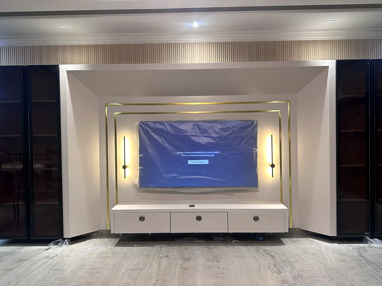 TV wall and symmetrical display shelving