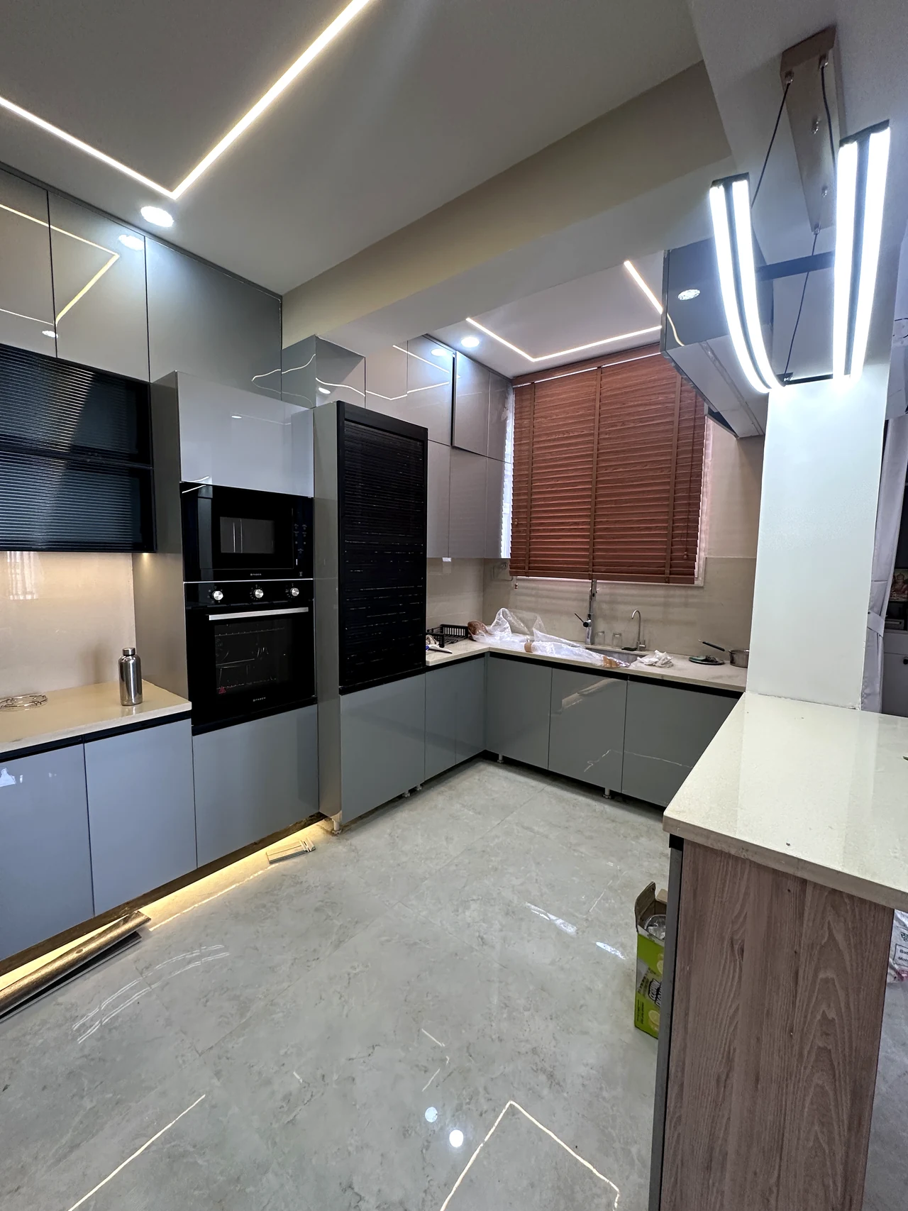Kitchen worktop and tall storage seen from the opposite side