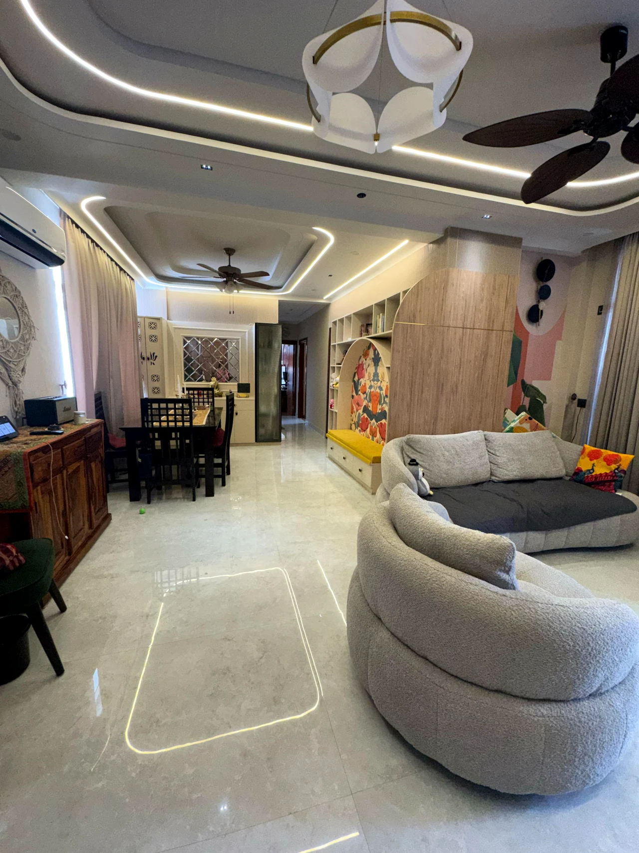 Open-plan view connecting the kitchen, living room and timber partition