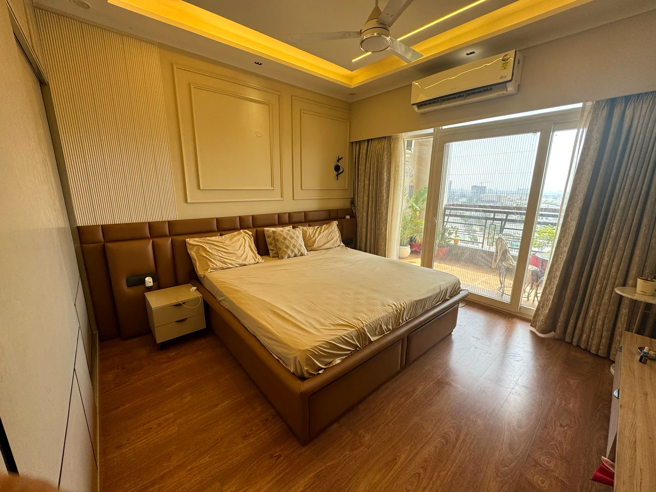 Bedroom with a timber feature wall and soft integrated lighting