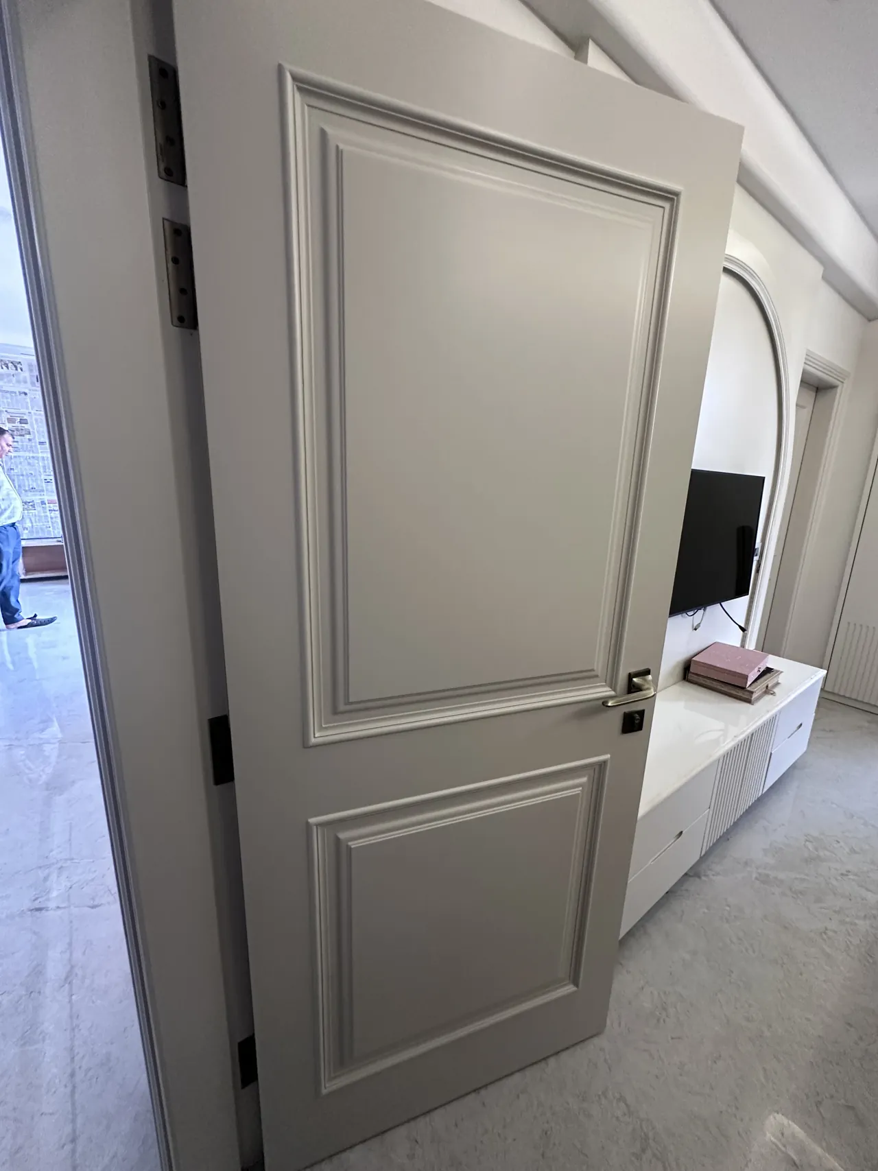 Close view of the moulded door detailing and adjacent interior
